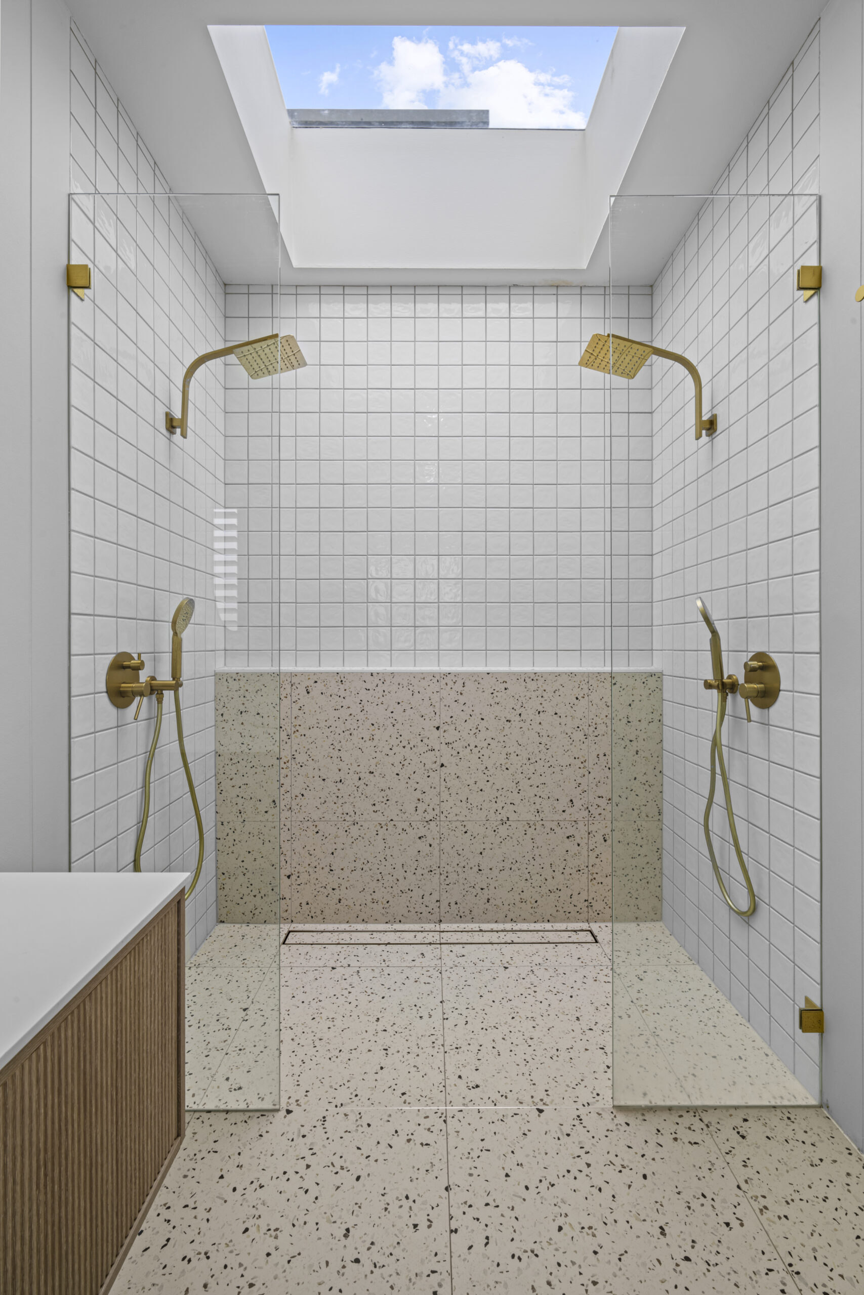 Waterproofed and tiled shower with brass tapware by Daylo Build