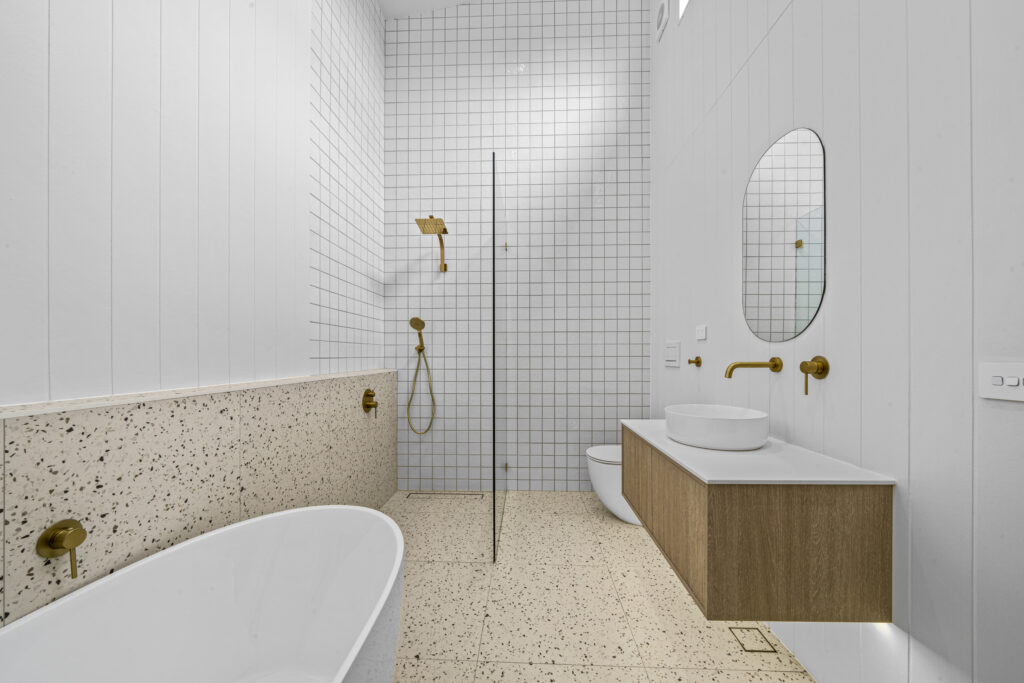 Renovated bathroom vanity and shower by Daylo Build