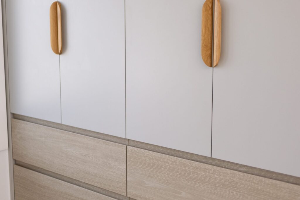 Custom built-in cabinetry with timber pull handles made in-house by Daylo Build
