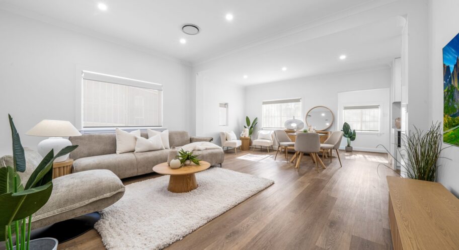 Open-plan living room renovation, West Ryde Renovated open-plan living and dining room with timber flooring in West Ryde by Daylo Build
